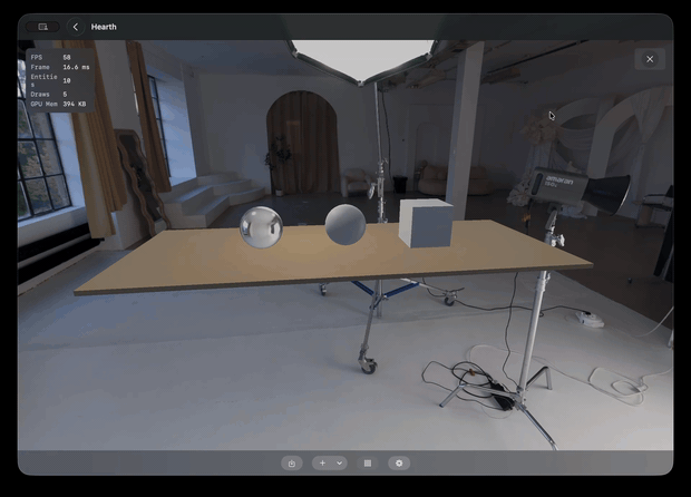 Animated demo of Hearth's auto-orbit mode rotating around the default scene on macOS